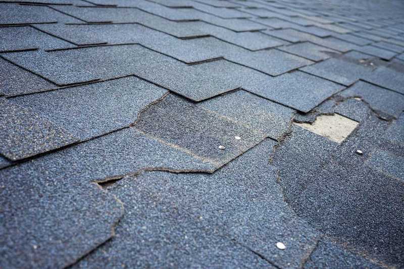 Damaged, cracked, and worn out shingles
