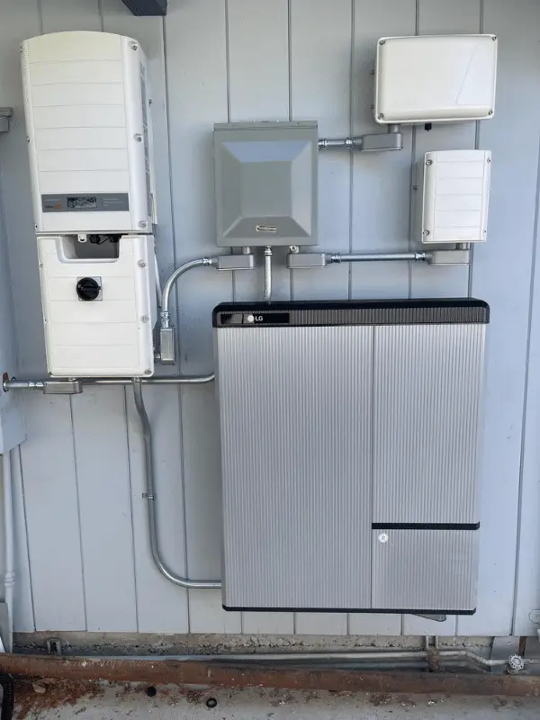 2 roofers performing solar installation